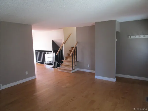 a view of empty room with stairs