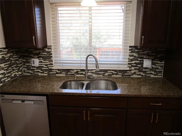 a kitchen with a sink and a window