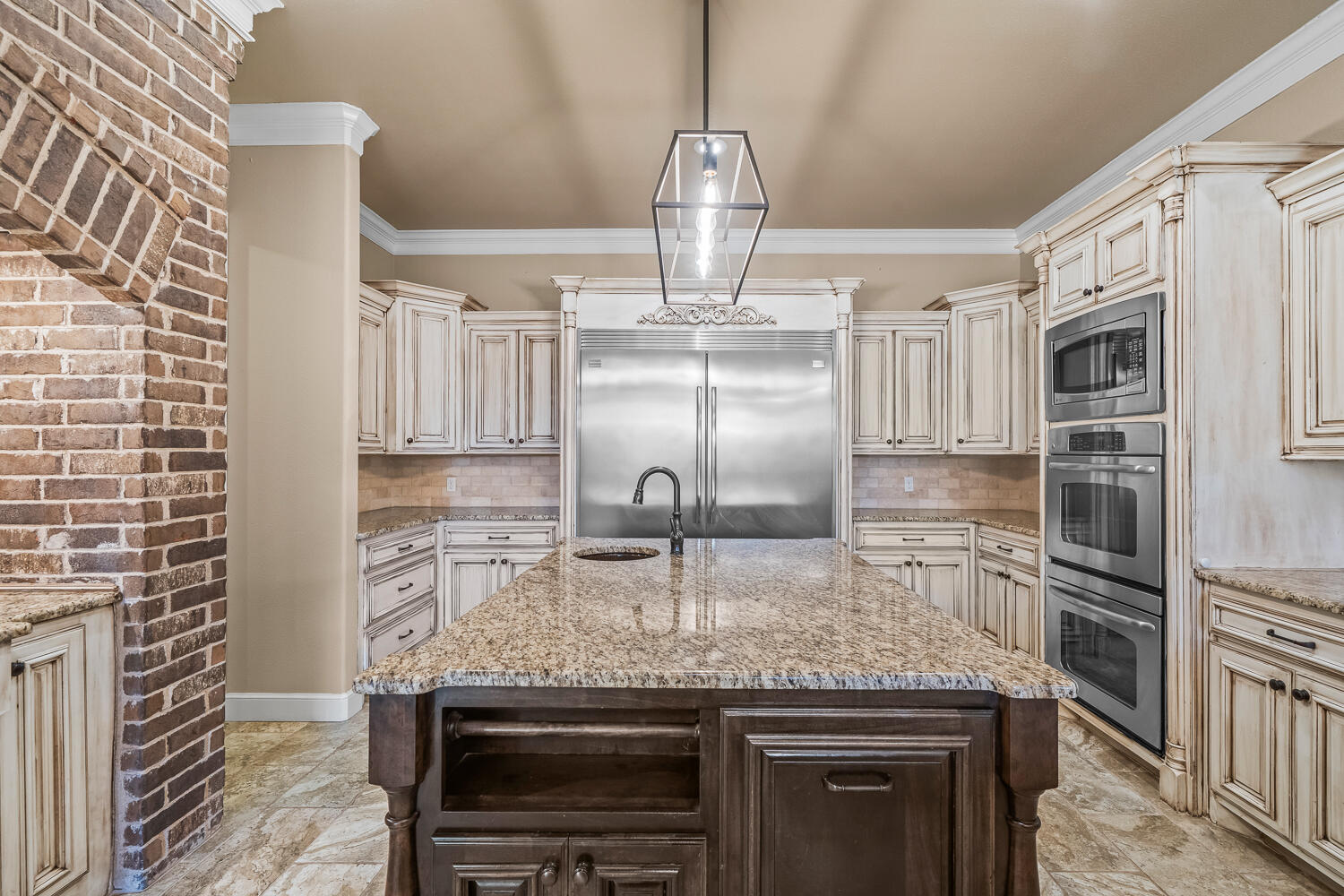 4509 103rd Street Lubbock, TX 79424 - Photo 11 of 94 a kitchen with kitchen island granite countertop stainless steel appliances and a counter space