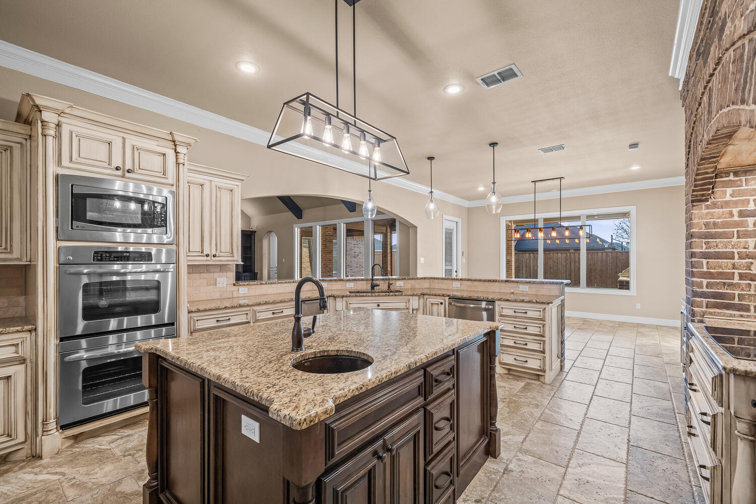 4509 103rd Street Lubbock, TX 79424 - Photo 13 of 94 a kitchen with stainless steel appliances granite countertop a sink and a stove