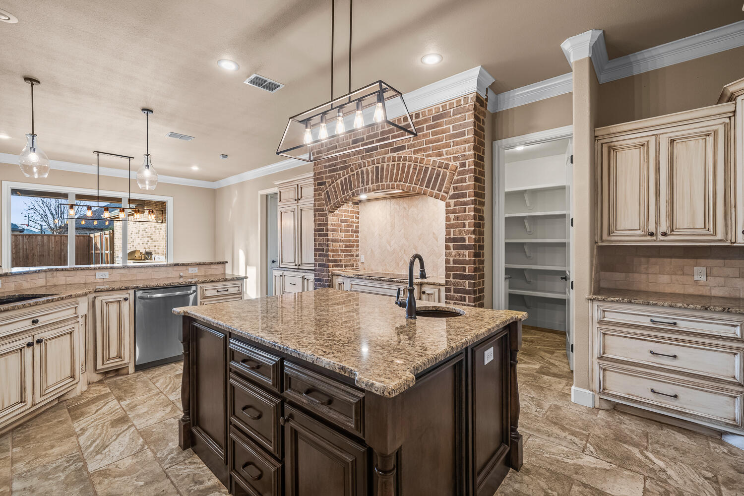 4509 103rd Street Lubbock, TX 79424 - Photo 17 of 94 a kitchen with stainless steel appliances granite countertop a kitchen island a stove and a sink
