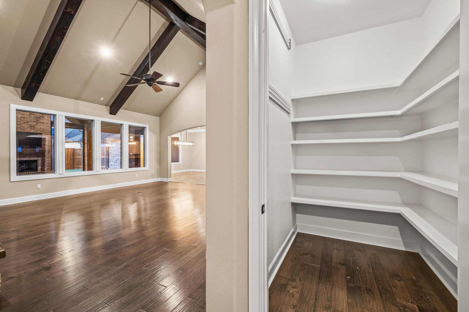 4509 103rd Street Lubbock, TX 79424 - Photo 22 of 94 a view of an empty room with wooden floor and staircase