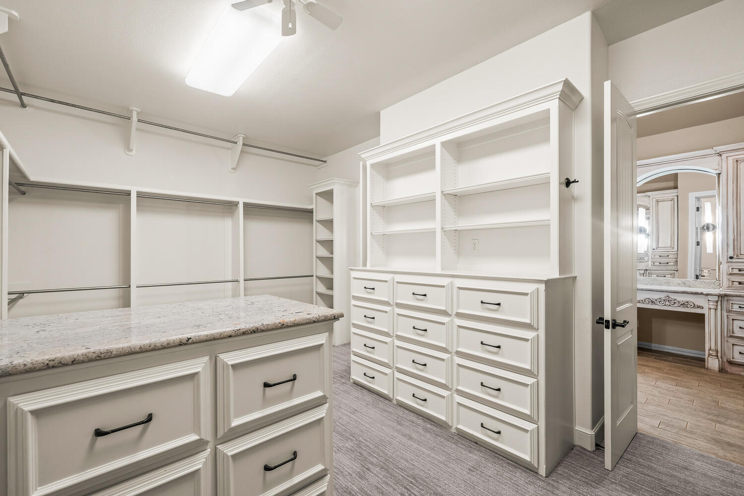 4509 103rd Street Lubbock, TX 79424 - Photo 36 of 94 a kitchen with cabinets appliances and a wooden floor
