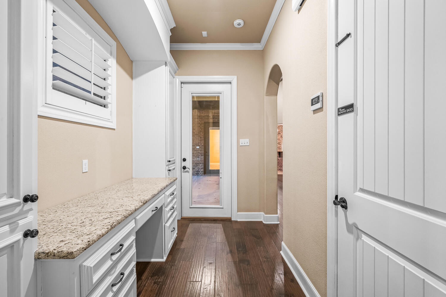 4509 103rd Street Lubbock, TX 79424 - Photo 41 of 94 a bathroom with a granite countertop sink and a wooden floor