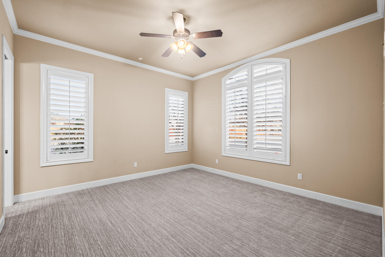 4509 103rd Street Lubbock, TX 79424 - Photo 48 of 94 a view of an empty room with a window and a ceiling fan