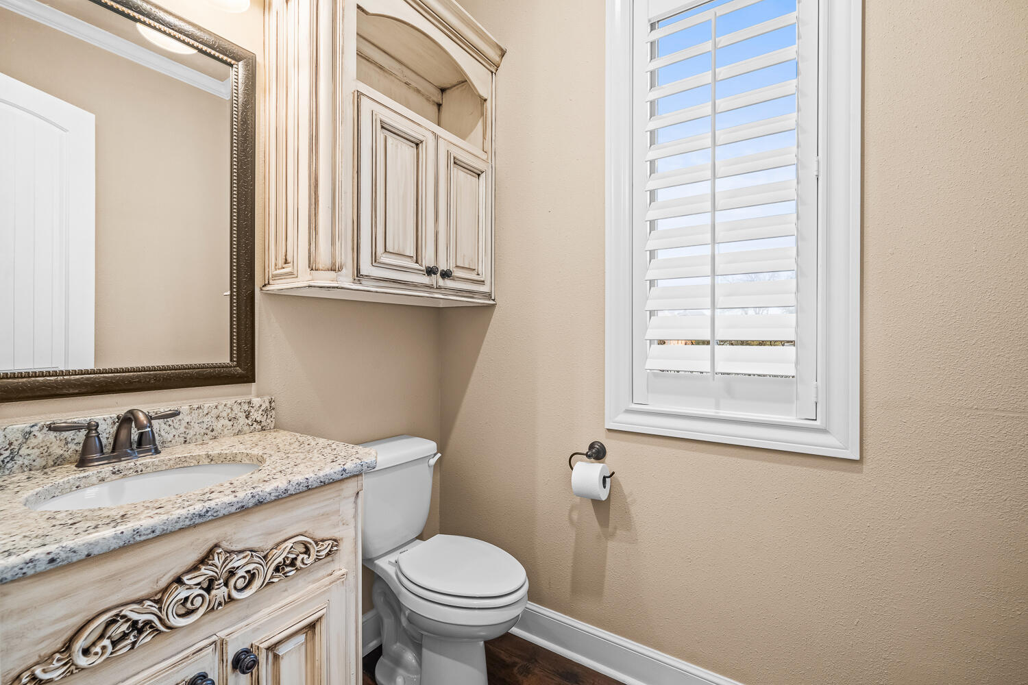 4509 103rd Street Lubbock, TX 79424 - Photo 50 of 94 a bathroom with a granite countertop sink toilet and a mirror
