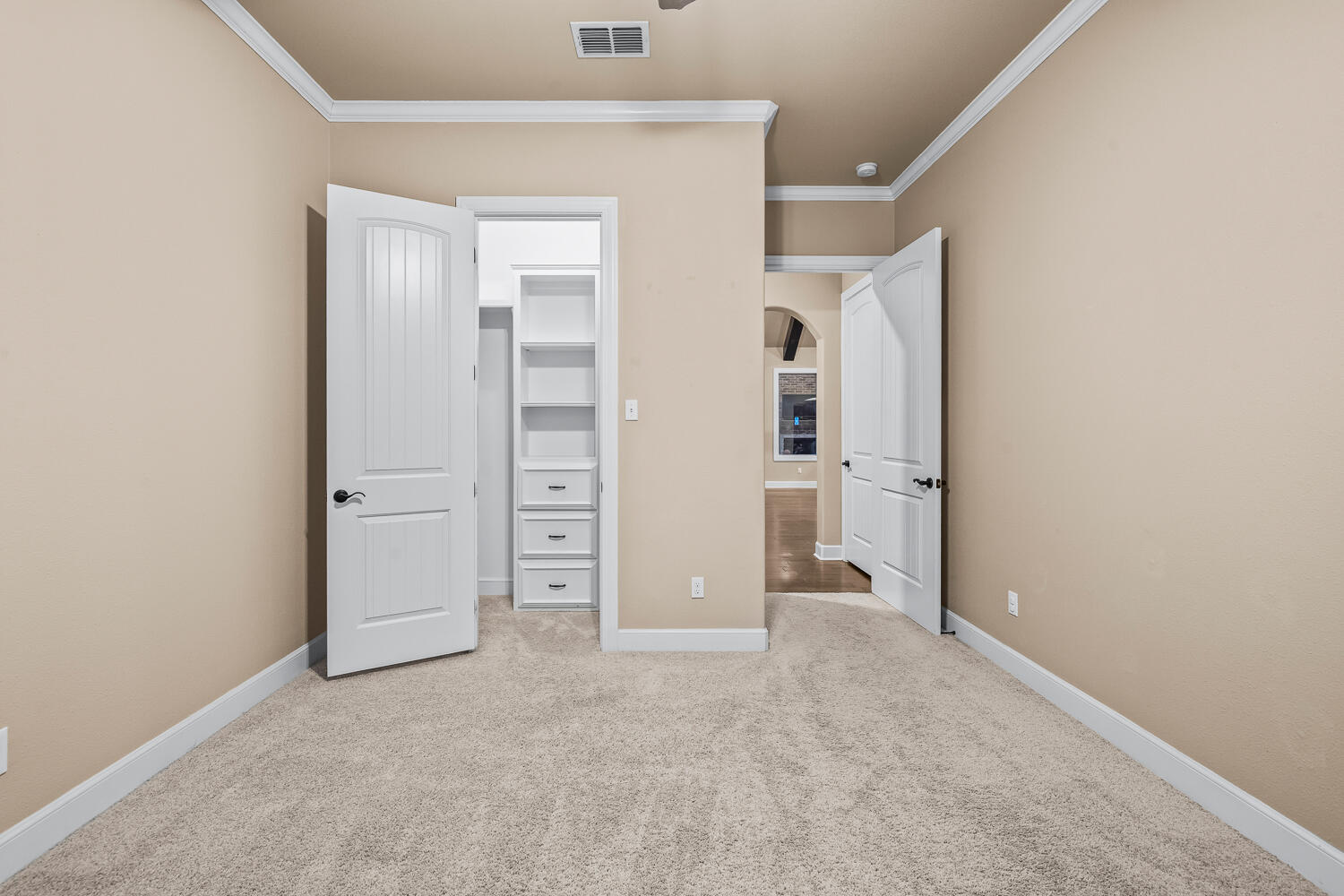 4509 103rd Street Lubbock, TX 79424 - Photo 60 of 94 an empty room with closet and wooden door