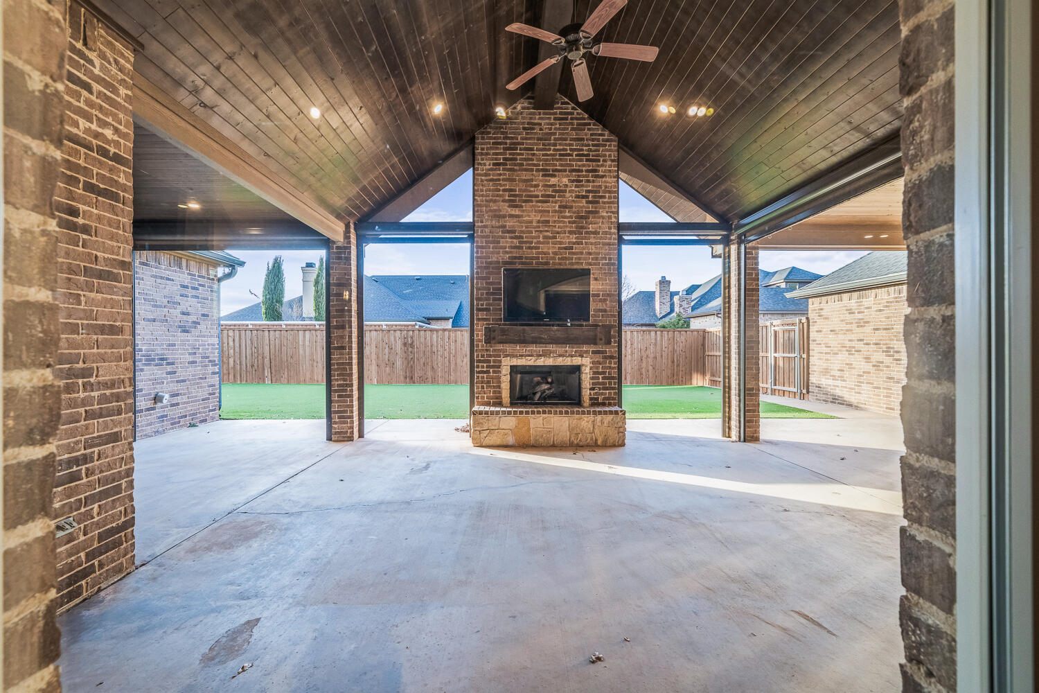 4509 103rd Street Lubbock, TX 79424 - Photo 78 of 94 a view of an empty room with a fireplace and a window