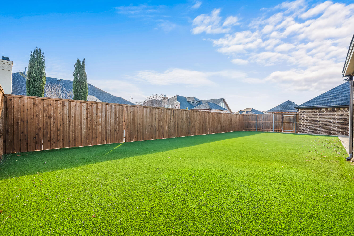 4509 103rd Street Lubbock, TX 79424 - Photo 87 of 94 a view of a backyard with wooden fence