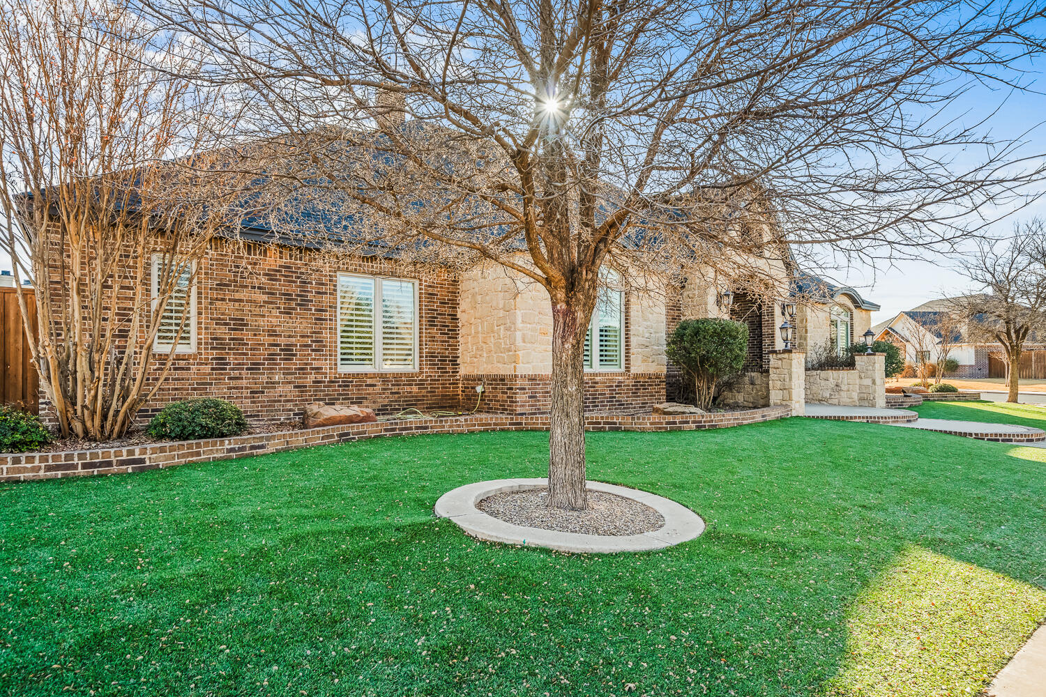 4509 103rd Street Lubbock, TX 79424 - Photo 93 of 94 a front view of a house with garden and trees
