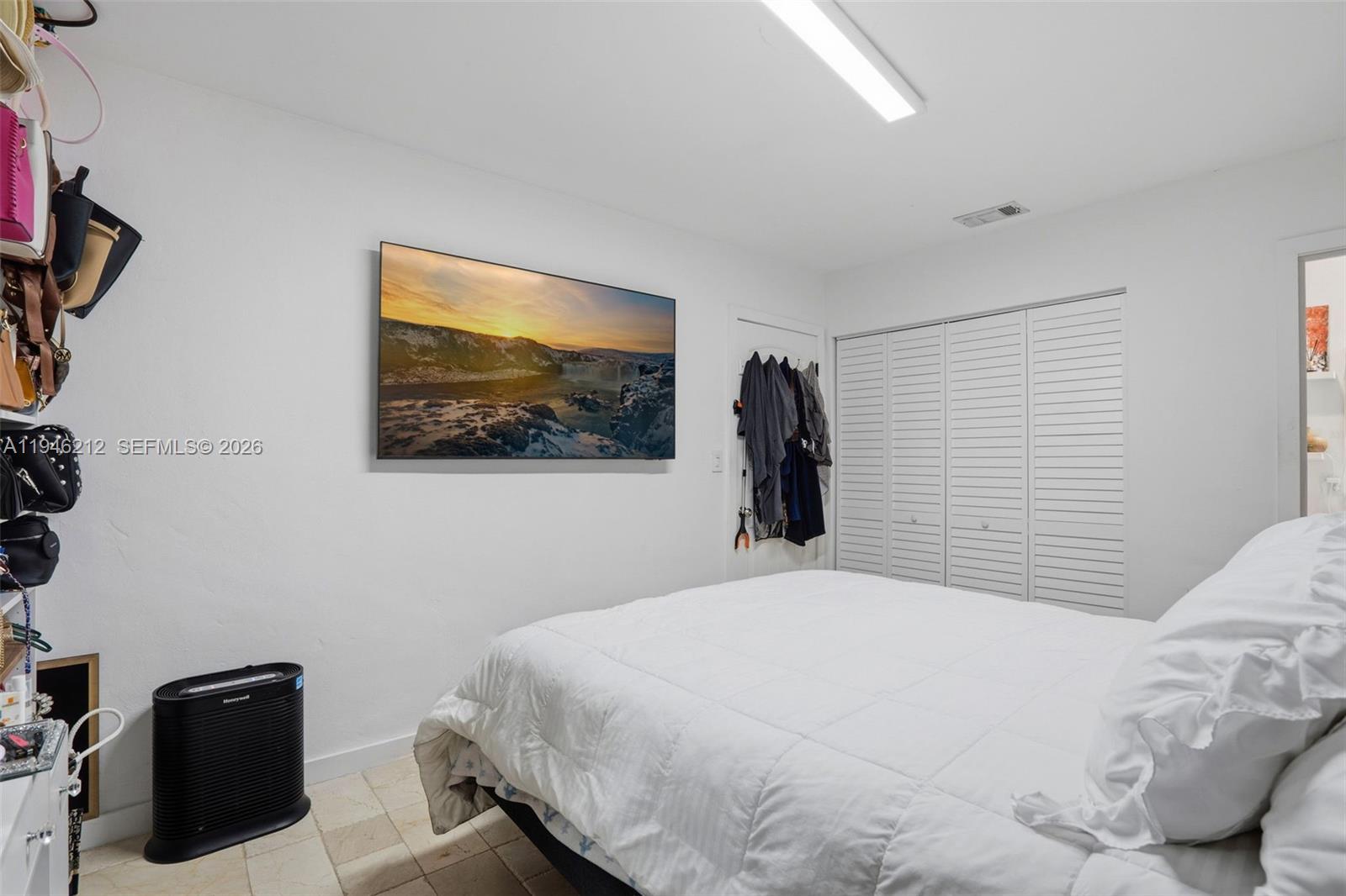 4335 Southwest 98th Court Miami, FL 33165 - Photo 24 of 38 a bedroom with a bed and a wall painting