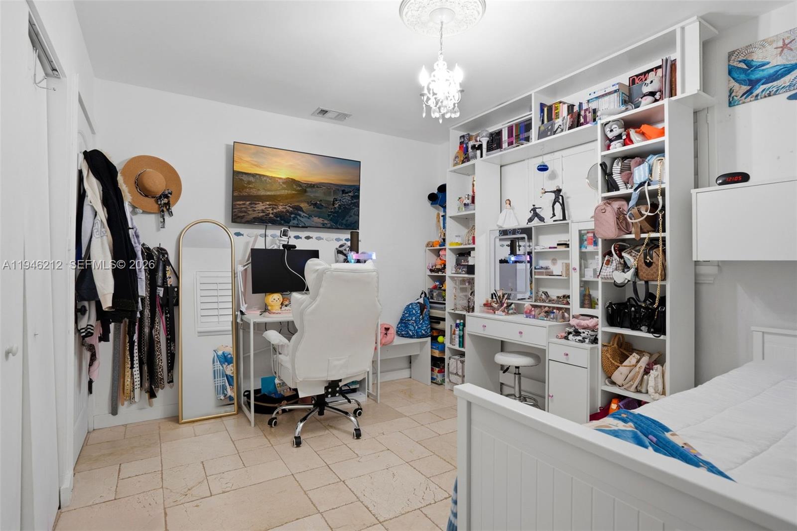 4335 Southwest 98th Court Miami, FL 33165 - Photo 27 of 38 a room with gym equipment and a flat screen tv