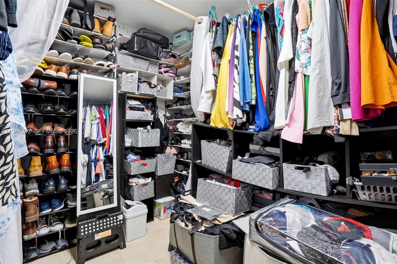 4335 Southwest 98th Court Miami, FL 33165 - Photo 30 of 38 a room with lots of different colored cloths