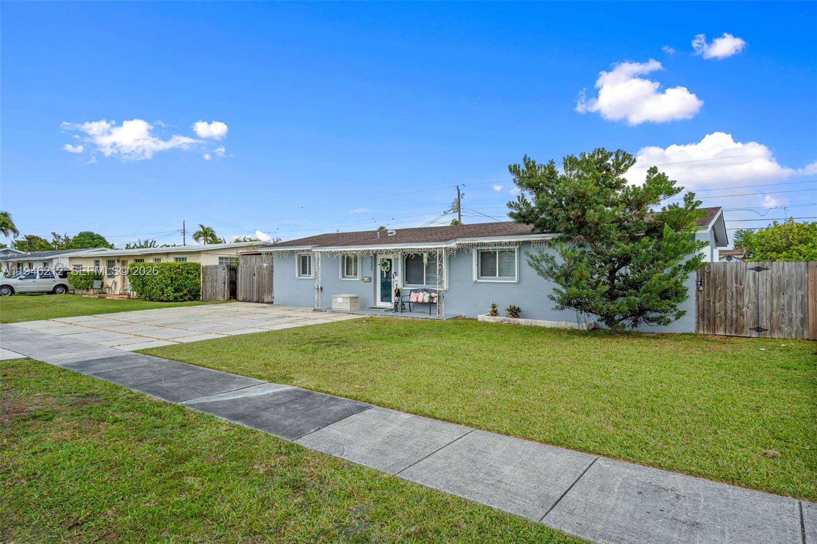 4335 Southwest 98th Court Miami, FL 33165 - Photo 3 of 38 a front view of a house with garden
