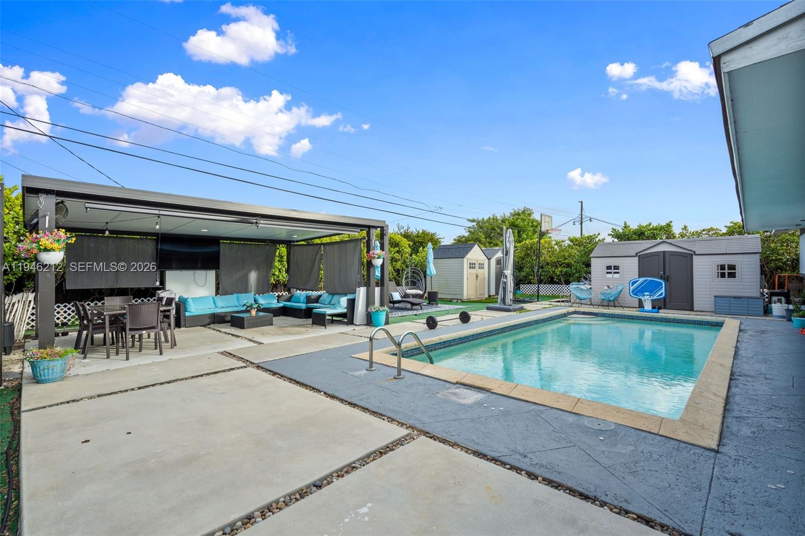 4335 Southwest 98th Court Miami, FL 33165 - Photo 31 of 38 a view of a house with swimming pool and sitting area