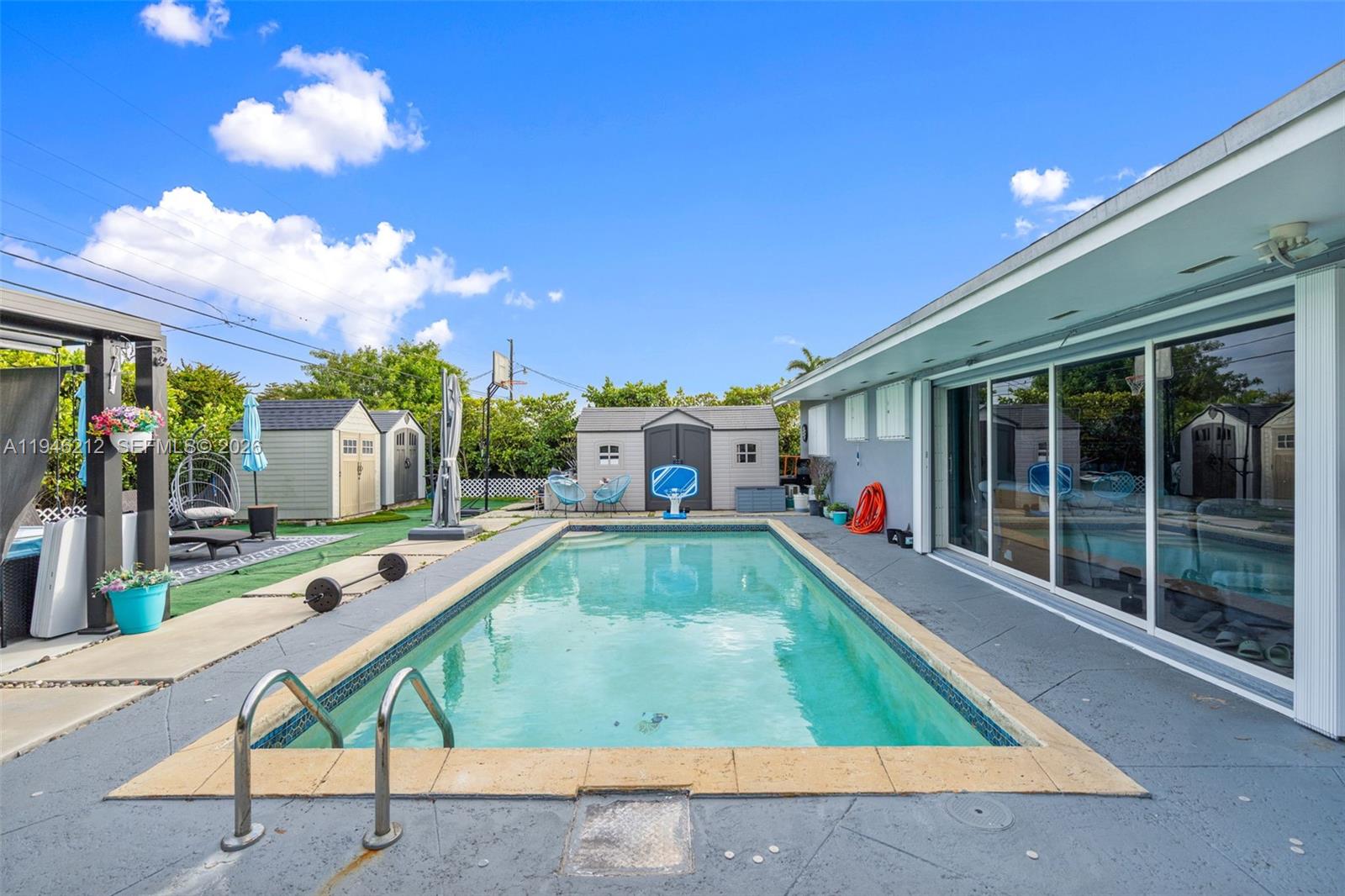 4335 Southwest 98th Court Miami, FL 33165 - Photo 32 of 38 a room with lots of furniture and a large window