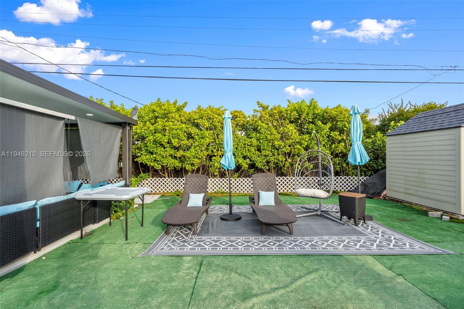 4335 Southwest 98th Court Miami, FL 33165 - Photo 34 of 38 a view of a porch with chairs and potted plants