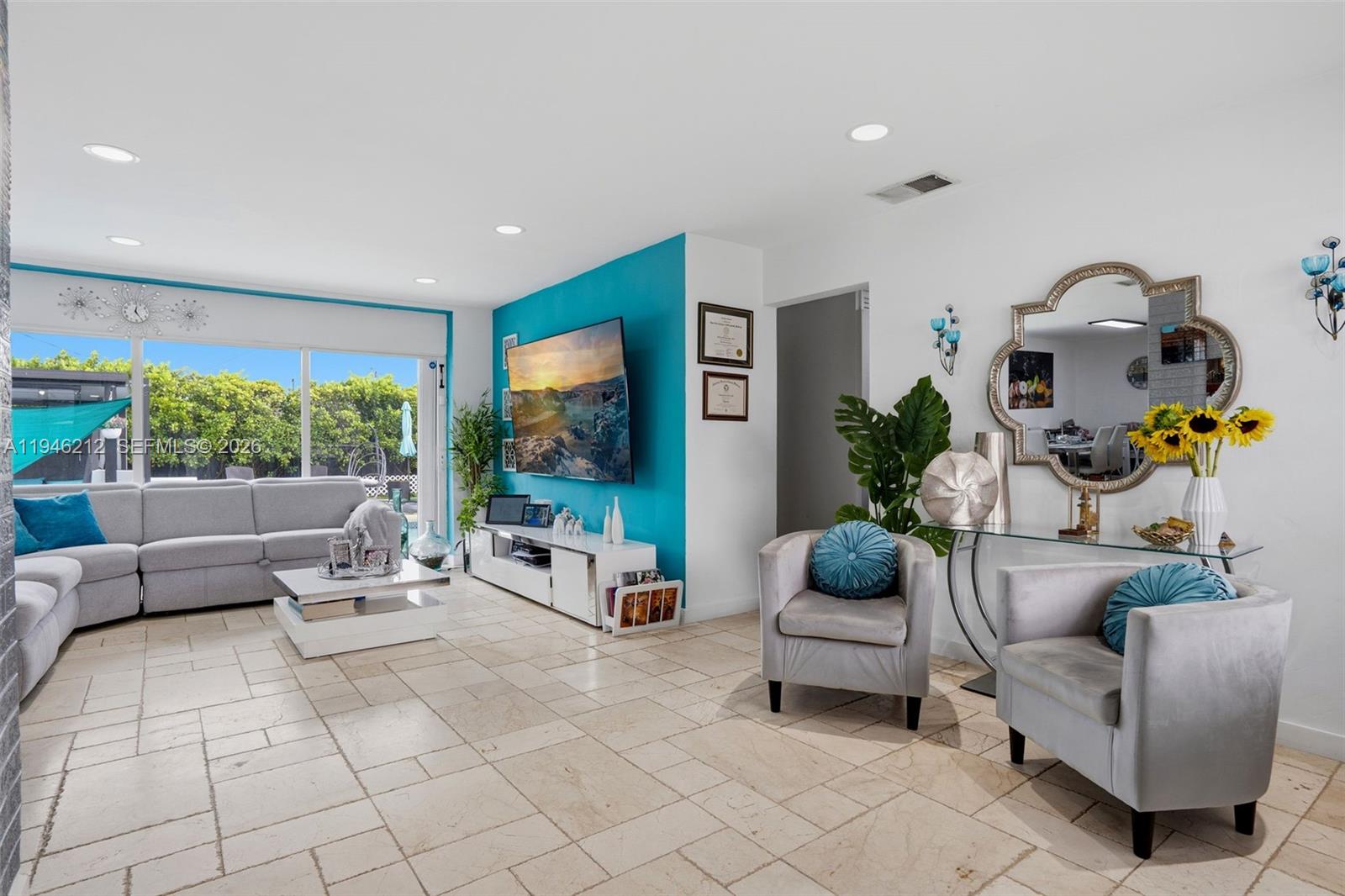 4335 Southwest 98th Court Miami, FL 33165 - Photo 4 of 38 a living room with furniture and a flat screen tv