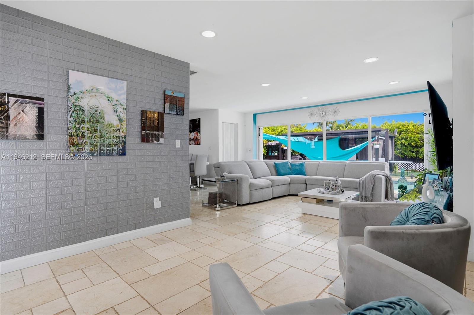 4335 Southwest 98th Court Miami, FL 33165 - Photo 6 of 38 a living room with furniture and a large window
