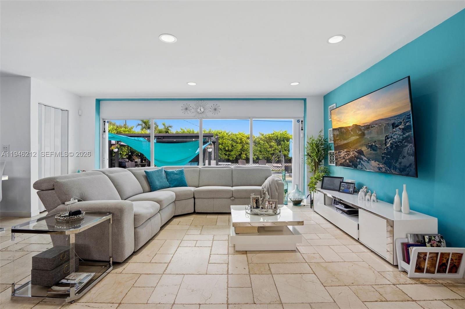 4335 Southwest 98th Court Miami, FL 33165 - Photo 7 of 38 a living room with furniture and a flat screen tv