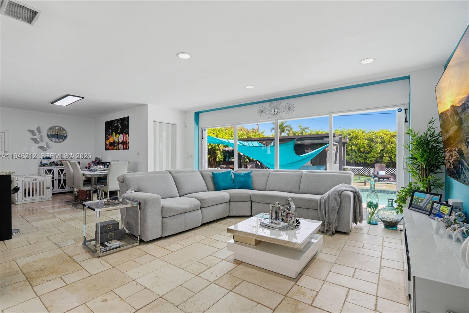 4335 Southwest 98th Court Miami, FL 33165 - Photo 8 of 38 a living room with furniture and a large window