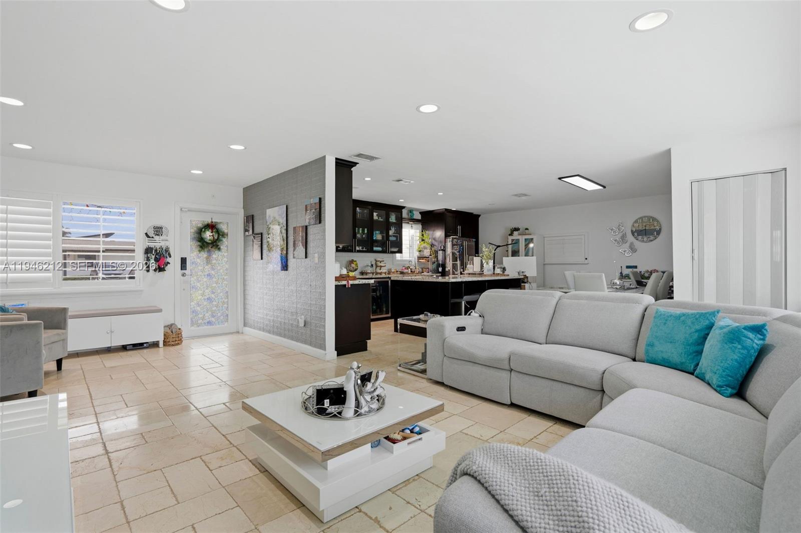 4335 Southwest 98th Court Miami, FL 33165 - Photo 9 of 38 a living room with furniture kitchen view and a table