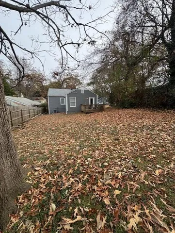 a backyard of a house with lots of green space