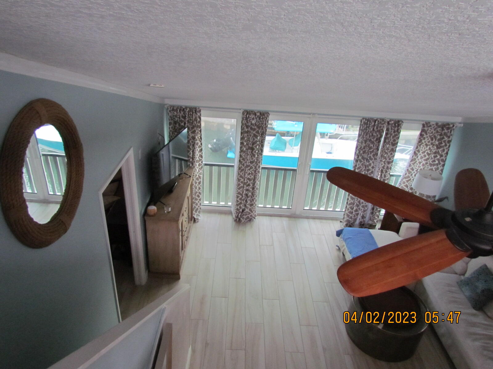 1456 Northeast Ocean Boulevard, Unit 2202 Stuart, FL 34996 - Photo 20 of 20 a living room with furniture and a wooden floor