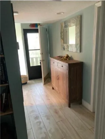 a view of kitchen with faucet and window