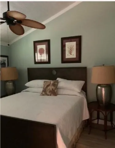 a bedroom with a bed and cabinets