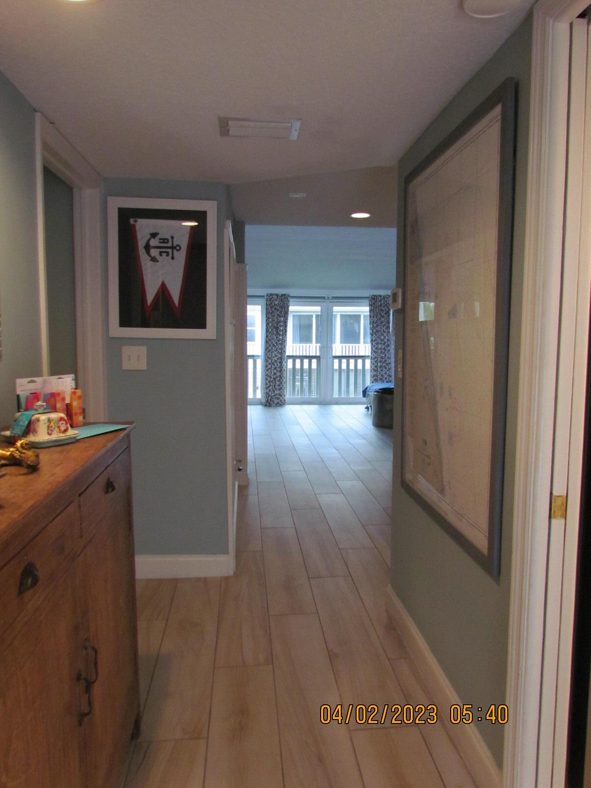 1456 Northeast Ocean Boulevard, Unit 2202 Stuart, FL 34996 - Photo 8 of 20 a hallway with wooden floor and workspace