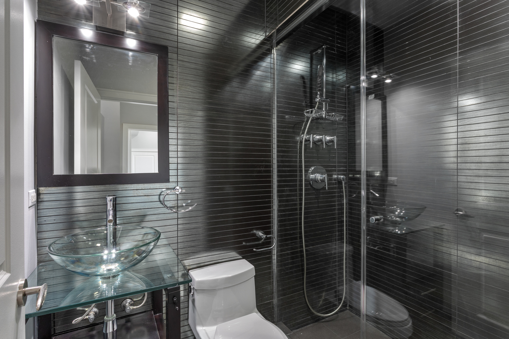 1412 West Morse Avenue, Unit 5D Chicago, IL 60626 - Photo 12 of 16 a bathroom with a toilet and a shower