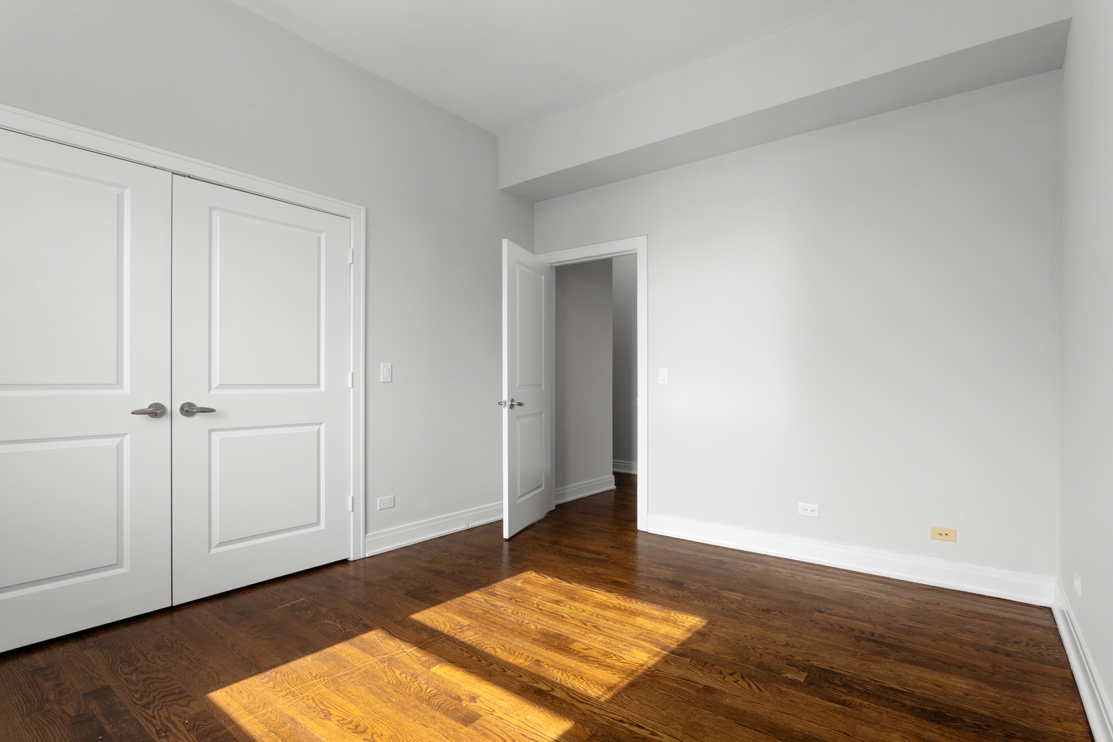 1412 West Morse Avenue, Unit 5D Chicago, IL 60626 - Photo 9 of 16 a view of an empty room and wooden floor