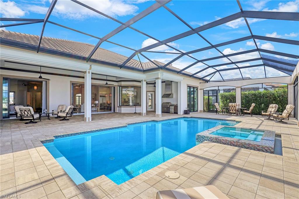 16459 Seneca Way Naples, FL 34110 - Photo 12 of 50 a view of a backyard with swimming pool