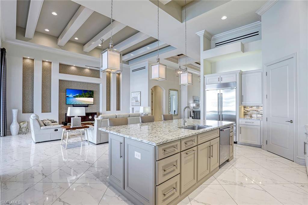 16459 Seneca Way Naples, FL 34110 - Photo 18 of 50 a bathroom with a granite countertop sink and a mirror