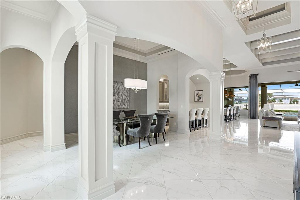 16459 Seneca Way Naples, FL 34110 - Photo 19 of 50 a lobby with furniture and a large window