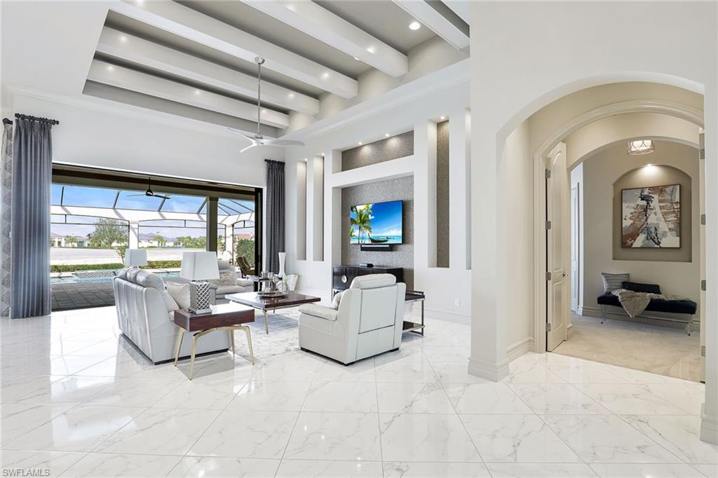 16459 Seneca Way Naples, FL 34110 - Photo 20 of 50 a living room with furniture and a large window