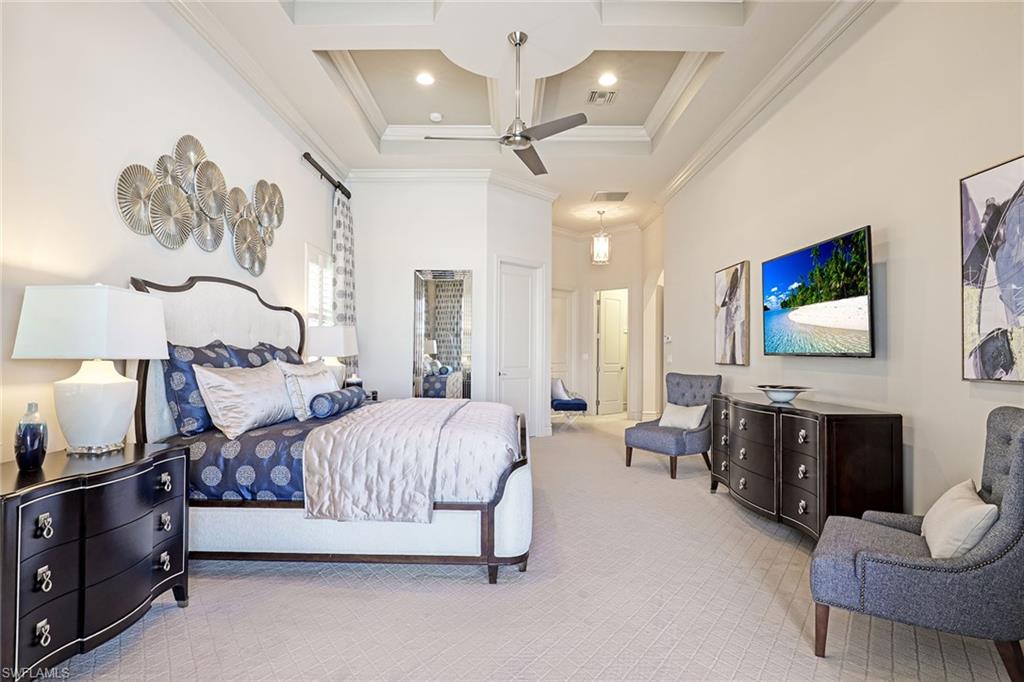 16459 Seneca Way Naples, FL 34110 - Photo 21 of 50 a spacious bedroom with a bed and furniture