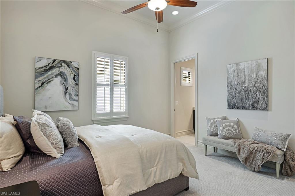 16459 Seneca Way Naples, FL 34110 - Photo 26 of 50 a bedroom with a bed couch and window