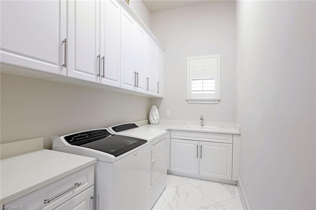 16459 Seneca Way Naples, FL 34110 - Photo 33 of 50 a utility room with sink dryer and washer