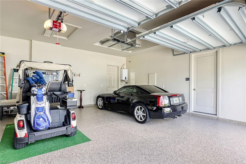 16459 Seneca Way Naples, FL 34110 - Photo 34 of 50 a car parked in a garage
