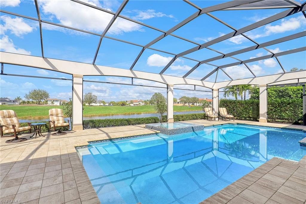 16459 Seneca Way Naples, FL 34110 - Photo 38 of 50 a view of swimming pool with outdoor seating