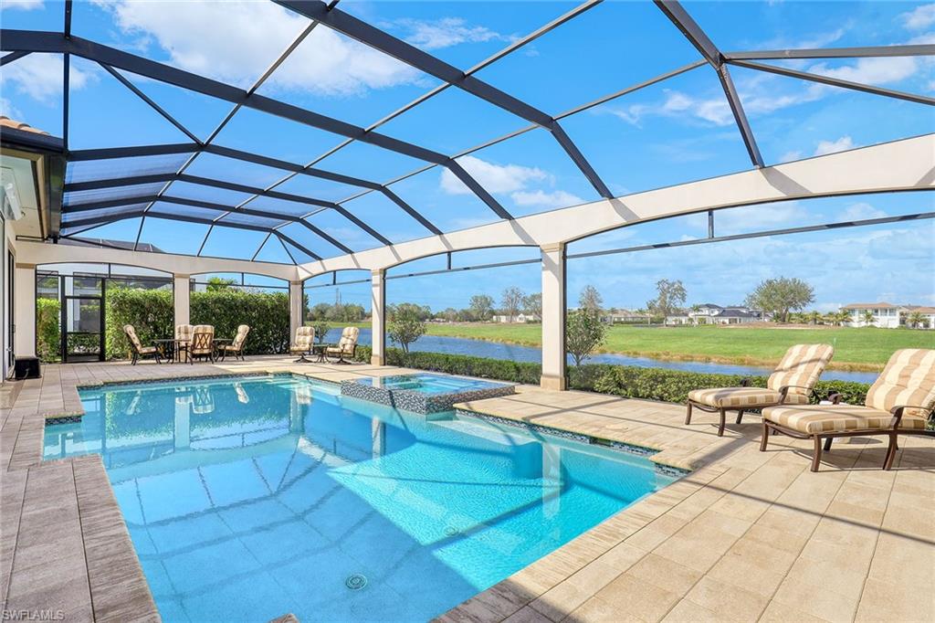 16459 Seneca Way Naples, FL 34110 - Photo 40 of 50 a view of a patio with swimming pool