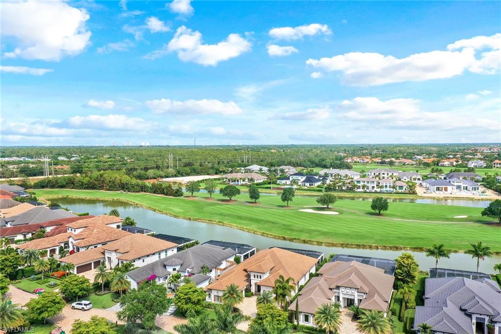 16459 Seneca Way Naples, FL 34110 - Photo 47 of 50 an aerial view of a city with lots of green space