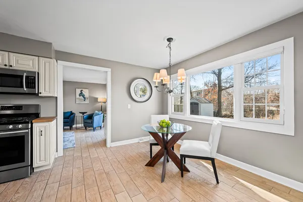 a view of a dining room with furniture window and wooden floor