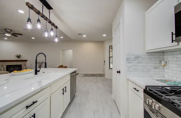 a kitchen with sink and stove