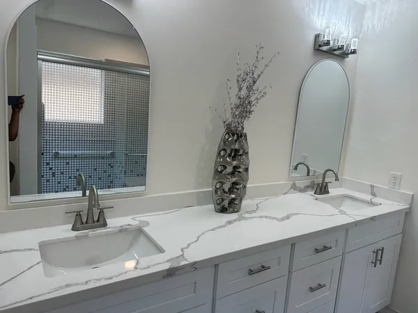 a bathroom with a sink and a mirror