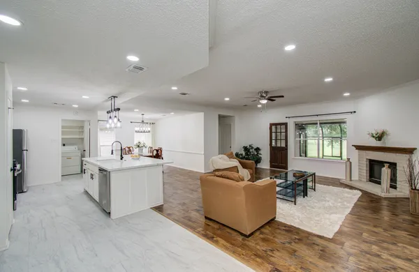 a living room with furniture and a fireplace