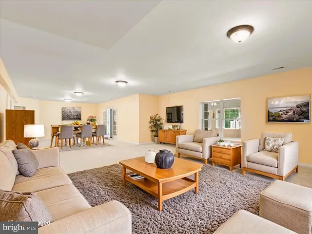a bathroom with a double vanity sink mirror and toilet