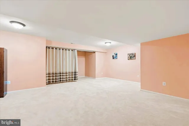 a view of an entryway with wooden floor and windows